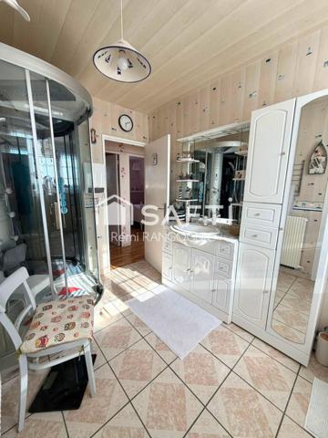 Maison 94 M2 avec 3 chambres, garage et jardin.