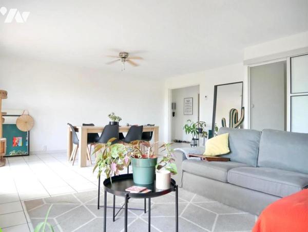 A proximité des Arceaux, appartement 97 m², 4 pièces, 3 chambres, avec place de parking et garage.