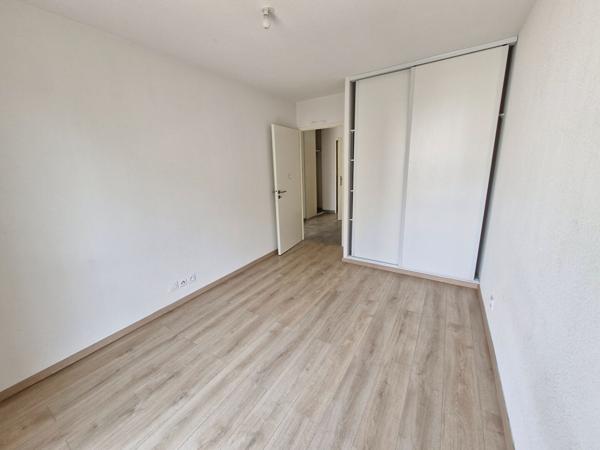 A LOUER - SAINT ORENS DE GAMEVILLE - Appartement  T2 d'une surface de 45.38 m² avec balcon et places de parkings -  217-FG