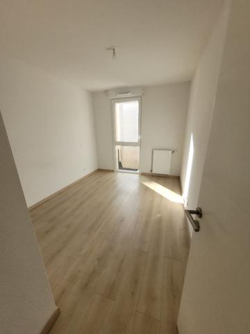 A LOUER - SAINT ORENS DE GAMEVILLE - Appartement  T2 d'une surface de 45.38 m² avec balcon et places de parkings -  217-FG