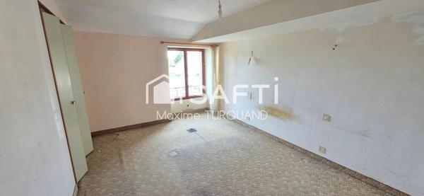 Maison 115m², 2/3chambres, 400m² de terrain avec garage.