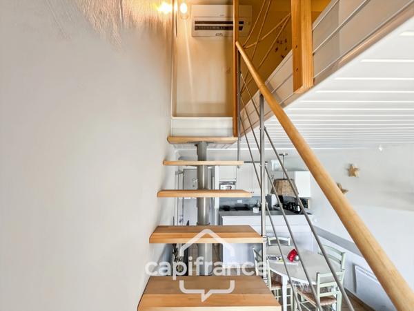 DERNIER ETAGE EN ANGLE CLIMATISE avec VUE PANORAMIQUE SUR LE LAC, BELLE EXPOSITION,appartement de 35 m2 , 2 chambres place de parking, cave et local vélos