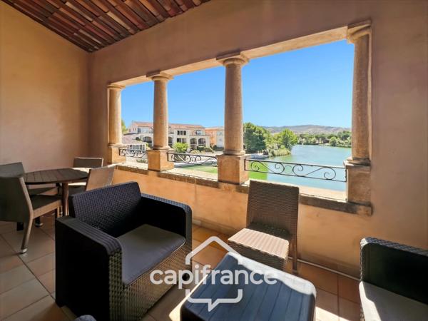 DERNIER ETAGE EN ANGLE CLIMATISE avec VUE PANORAMIQUE SUR LE LAC, BELLE EXPOSITION,appartement de 35 m2 , 2 chambres place de parking, cave et local vélos