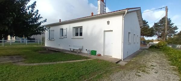 Maison proche commerces avec garage.