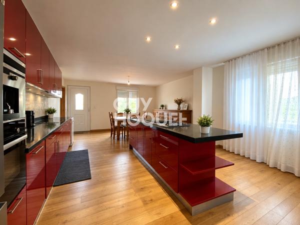 Immeuble de rapport – 2 logements + 2 locaux commerciaux