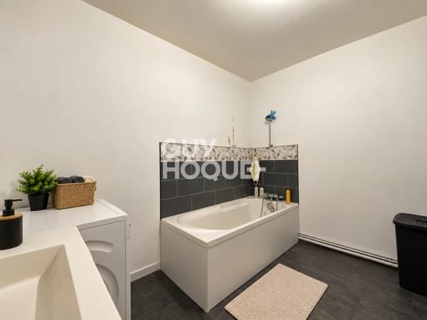 Immeuble de rapport – 2 logements + 2 locaux commerciaux