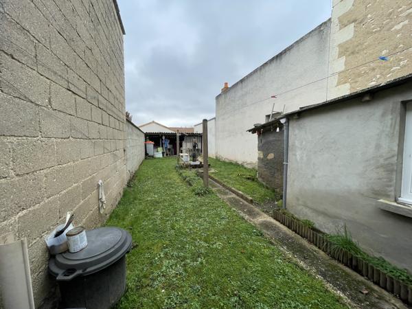 Maison de bourg bien située, avec jardin et potentiel d'aménagement