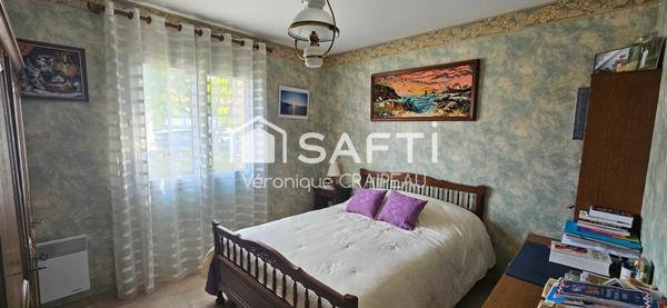 Maison de plain pied proche clinique avec 3 chambres, garage et abri-terrasse.