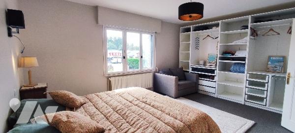 Villa de 190m² aux beaux volumes avec vaste terrain boisé à CUCQ