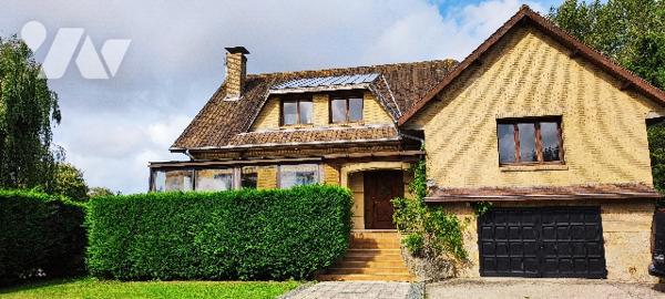 Villa de 190m² aux beaux volumes avec vaste terrain boisé à CUCQ