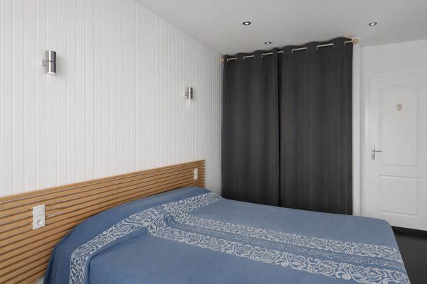 Appartement 2 pièces de 38 m2 rénové à proximité du centre ville avec une grande terrasse, une cave et un grand garage