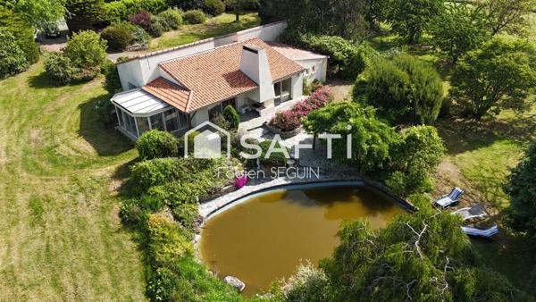 Une vie de plain-pied au calme et au cœur d'un  parc arboré de 7813 m2