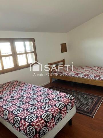 MAISON EN PIERRE TYPE 9 DANS LE VILLAGE DE CASTELNEAU DE MONTMIRAL