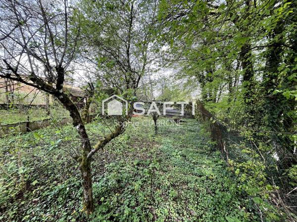 À vendre à Cantebonne , Terrain d'une superficie de 11 ares + Maison 95 M2 avec Garages