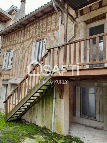 Bel appartement avec local commercial et dépendances