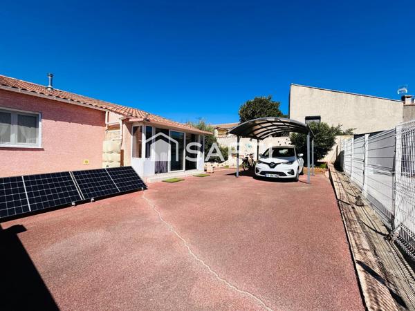 Maison plain-pied avec garage sur terrain de 380m2