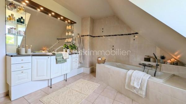 EXCLUSIVITE

Située à Mathieu dans un environnement privilégié au calme absolu, cette propriété d'exception de 196 m² habitables offre des prestations de qualité sur une parcelle superbement arborée de 1 200 m², entièrement close et sans aucun vis-à-vis.

Des volumes baignés de lumière
L'entrée avec rangements s'ouvre sur une pièce de vie magistrale de 64 m² en L, bénéficiant d'une triple exposition. 
La cuisine aménagée, semi-ouverte, complète cet espace de réception. 
Le rez-de-chaussée, intégralement accessible, dispose également d'un wc indépendant et d'une chambre avec sa salle d'eau privative.

*Un étage raffiné*
Un bel escalier en pierre naturelle mène à une mezzanine dédiée au bureau, desservant trois chambres, une salle de douche, un WC indépendant, ainsi qu'une vaste suite parentale avec salle de bain et WC privatifs.

Extérieurs et sous-sol
Le jardin principal et la terrasse sont orientés plein Sud, garantissant un ensoleillement optimal en toute intimité. Le sous-sol complet de 115 m² propose un garage, une buanderie et une pièce de 47 m² modulable selon vos projets.

Le confort technique
La maison dispose d'un adoucisseur d'eau, d'une aspiration centralisée, d'une surveillance vidéo et d'une sécurisation totale par portail et portillon.
Une demeure rare, bien isolée ( DPE en C ) , conjuguant confort moderne et sérénité aux portes de la Côte de Nacre.

N'attendez plus et contactez moi pour en savoir plus.