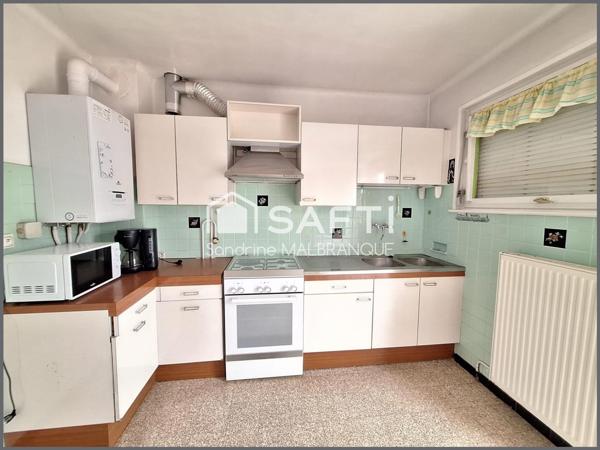 Maison de semi plain pied 3 chambres, grand jardin garage et stationnement privatif