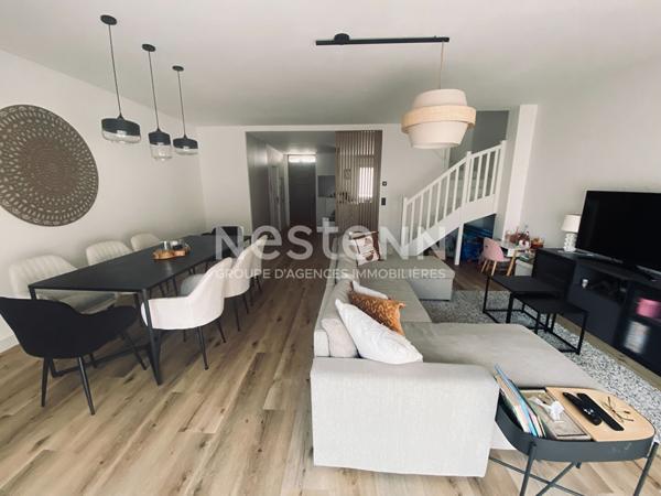 Prestations de qualité pour cette maison de 5PP avec terrasse et jardinet, place de parking en sous sol