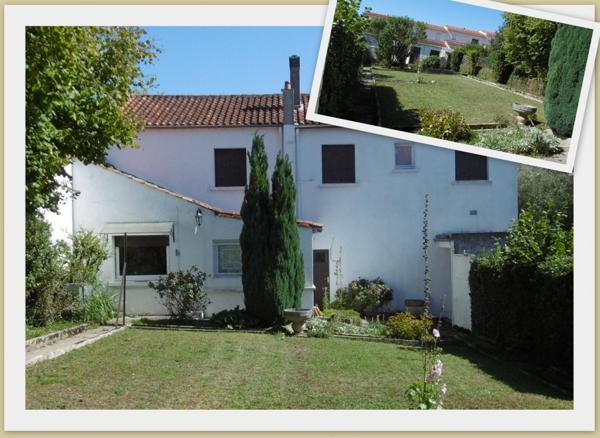 Maison avec garages et jardin