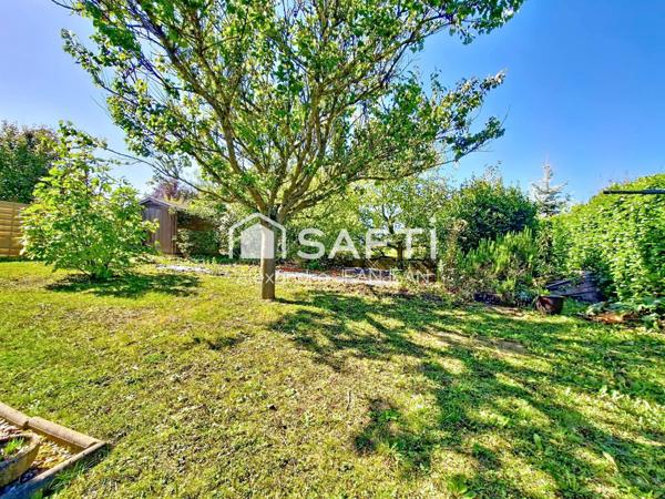 Maison de plain pied avec garage et jardin