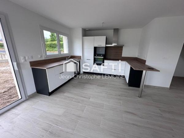 Pavillon 100 m2,trois chambres et garage plein centre