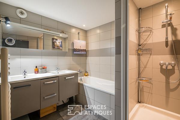 Loft industriel avec grand garage et terrasse plein Ouest