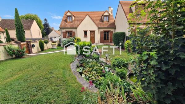 Maison familiale avec jardin arboré, véranda chauffée et chambre de plain-pied