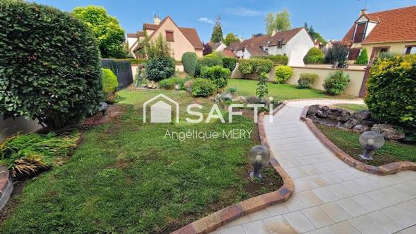 Maison familiale avec jardin arboré, véranda chauffée et chambre de plain-pied