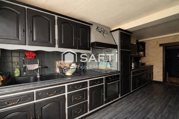 Confort, cour et garages : maison à ne pas manquer