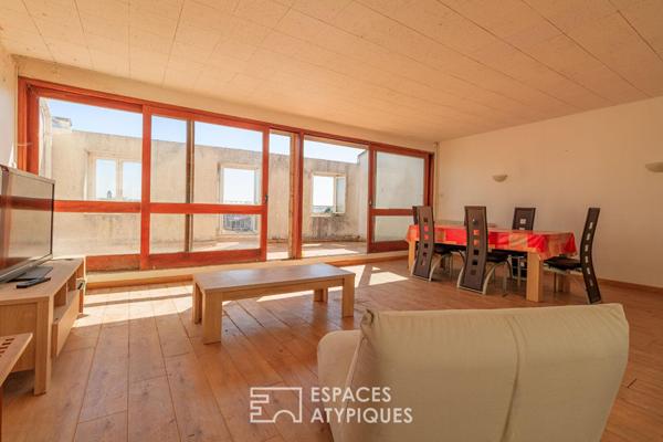 Appartement-terrasse à rénover avec sa vue sur les tours