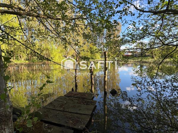 TERRAIN DE LOISIR AVEC ETANG ET MOBIL HOME
