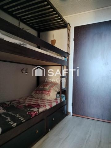 Studio de 31m² avec casier à ski, local partagé, placard privatif sur palier et parking