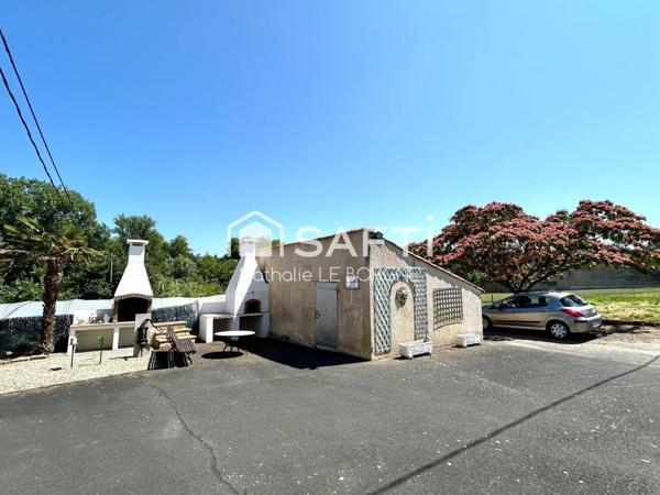 Ensemble immobilier : 2 maisons / hangars /annexes
