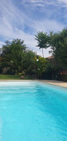 Maison individuelle 4 pièces 100 m² piscine et garage.