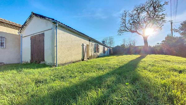 Maison 105 m² à rénover avec 3 chambres, garage et jardin à Réaup-Lisse
