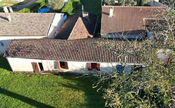 Maison 105 m² à rénover avec 3 chambres, garage et jardin à Réaup-Lisse