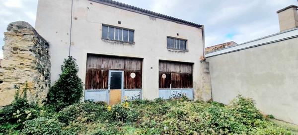 GARAGE DOUBLE AVEC TERRAIN COEUR DE VILLAGE