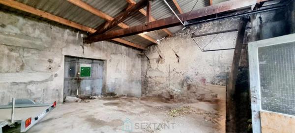 GARAGE DOUBLE AVEC TERRAIN COEUR DE VILLAGE