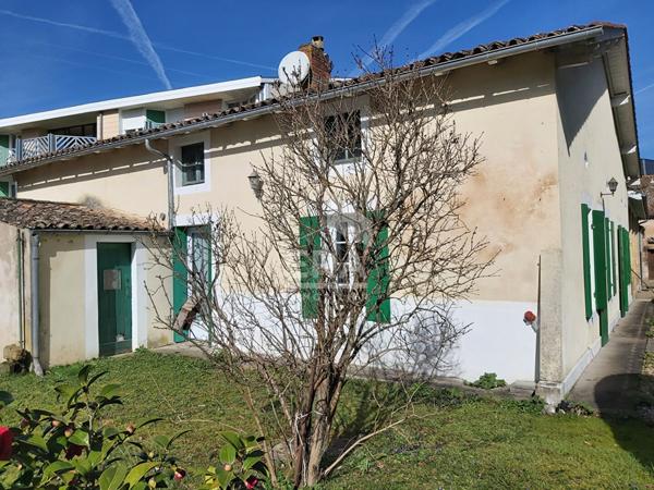 STE FOY LA GRANDE - dans un quartier privilégié, maison de plain-pied 124m² avec garage et jardin.