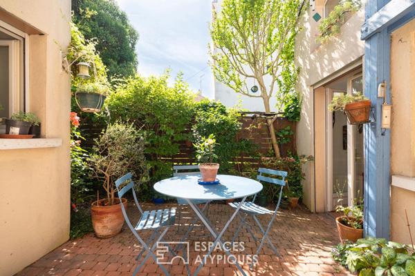 Maison avec terrasse arborée à la lisière du 20e