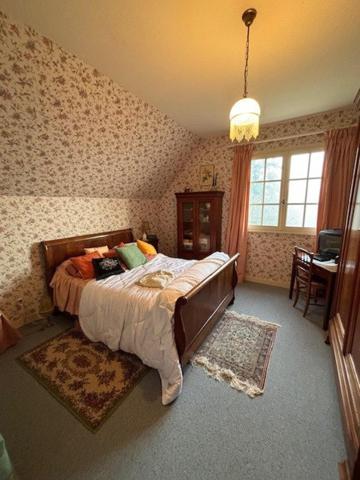 Coup de coeur pour cette belle maison et son parc boisé