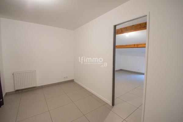 Duplex atypique dans un bâtiment historique.