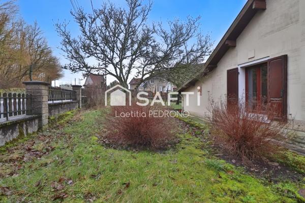 Maison avec garage, jardin et cave