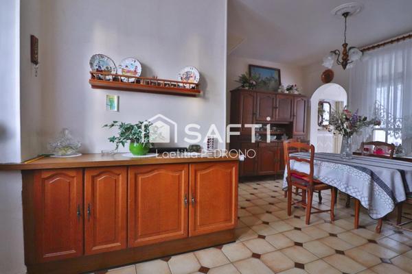 Maison avec garage, jardin et cave