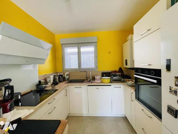 APPARTEMENT EN DUPLEX AVEC JARDIN 