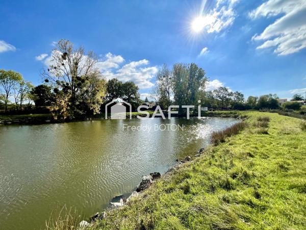 Maison avec terrain et étangs – fort potentiel !