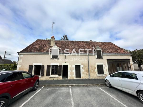 Maison avec beau potentiel locatif.