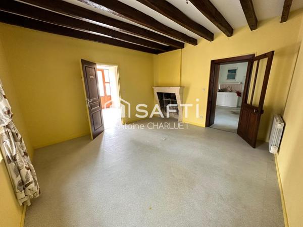 Maison avec beau potentiel locatif.