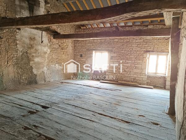 Proche Buxy, immeuble avec appartement et local commercial loué.